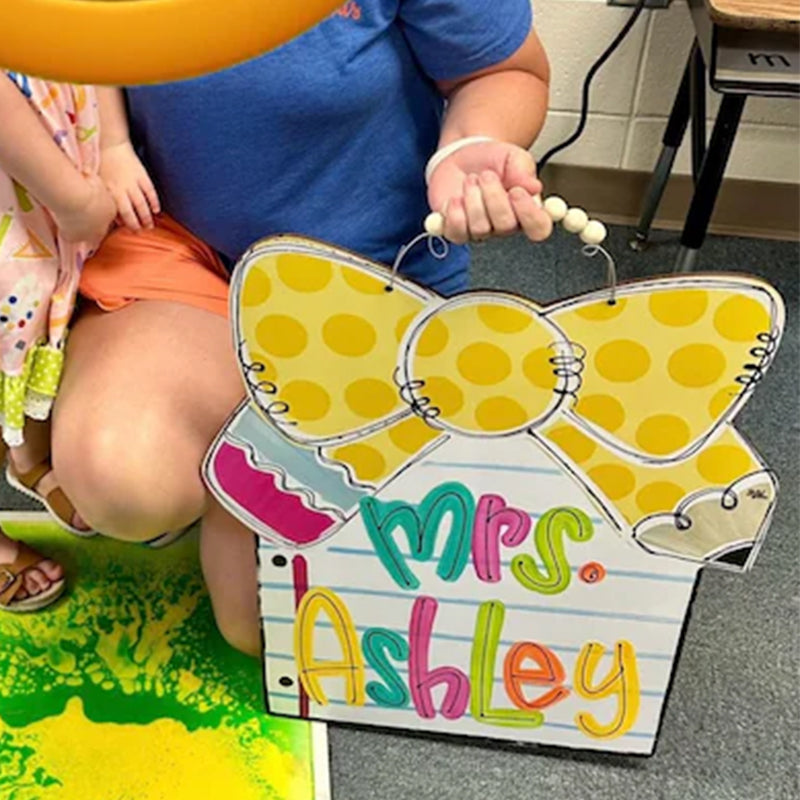 Notebook paper with pencil bow door hanger