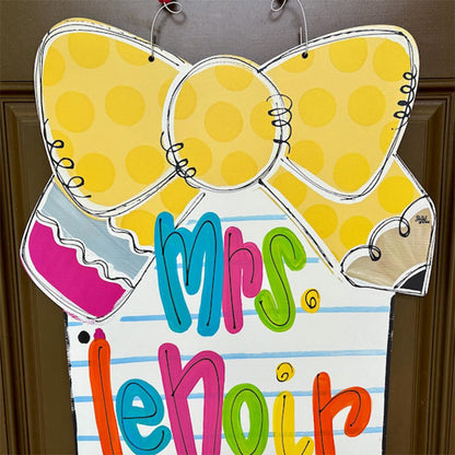 Notebook paper with pencil bow door hanger