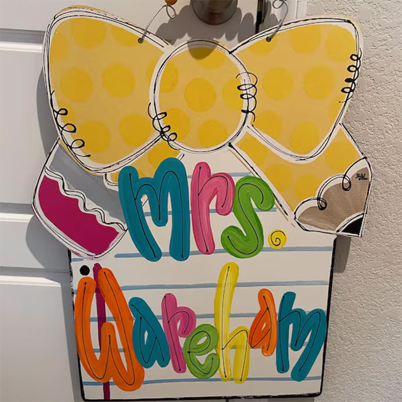 Notebook paper with pencil bow door hanger