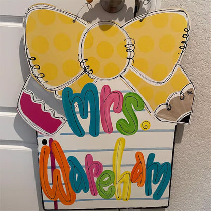 Notebook paper with pencil bow door hanger